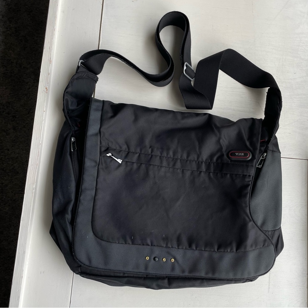 Flawed gem. Used Tumi laptop crossbody messenger bag. Expandable.